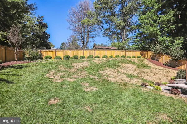 a bathroom with a sink vanity mirror and toilet