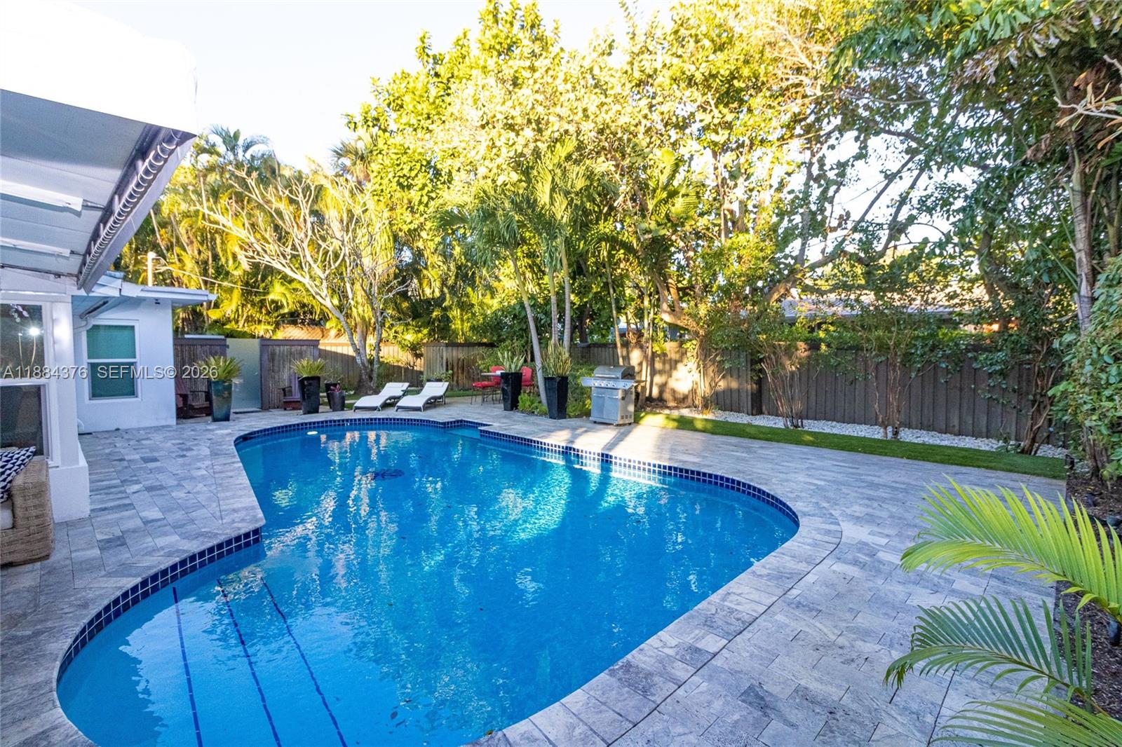 a view of a swimming pool with a patio