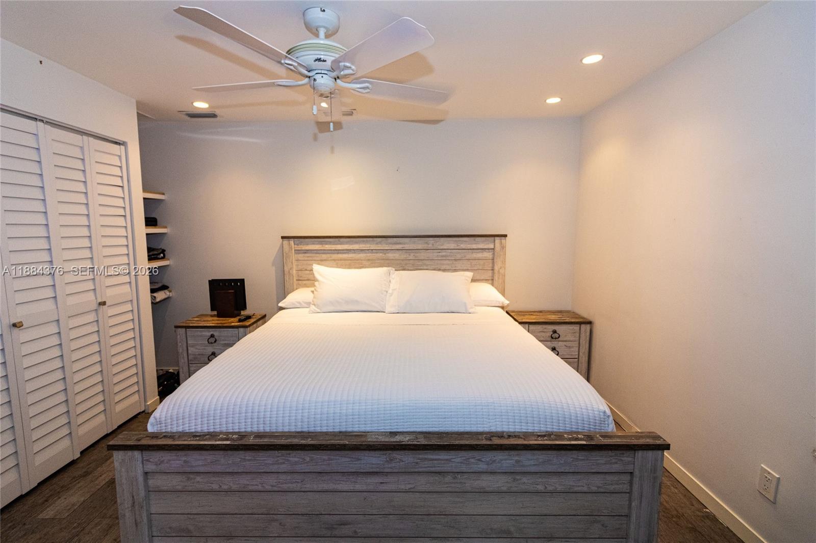 744 Northeast 16th Avenue Fort Lauderdale, FL 33304 - Photo 12 of 26 a bedroom with a bed and a ceiling fan