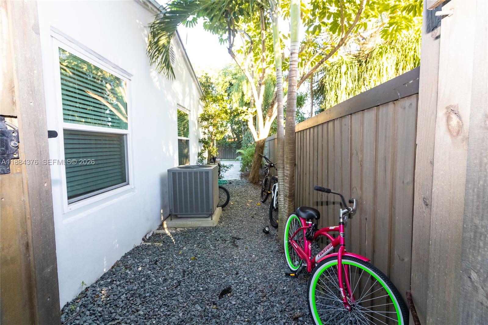 744 Northeast 16th Avenue Fort Lauderdale, FL 33304 - Photo 20 of 26 a view of a small yard with wooden fence