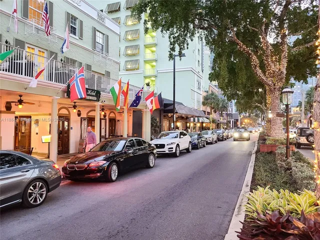 a view of a street with cars