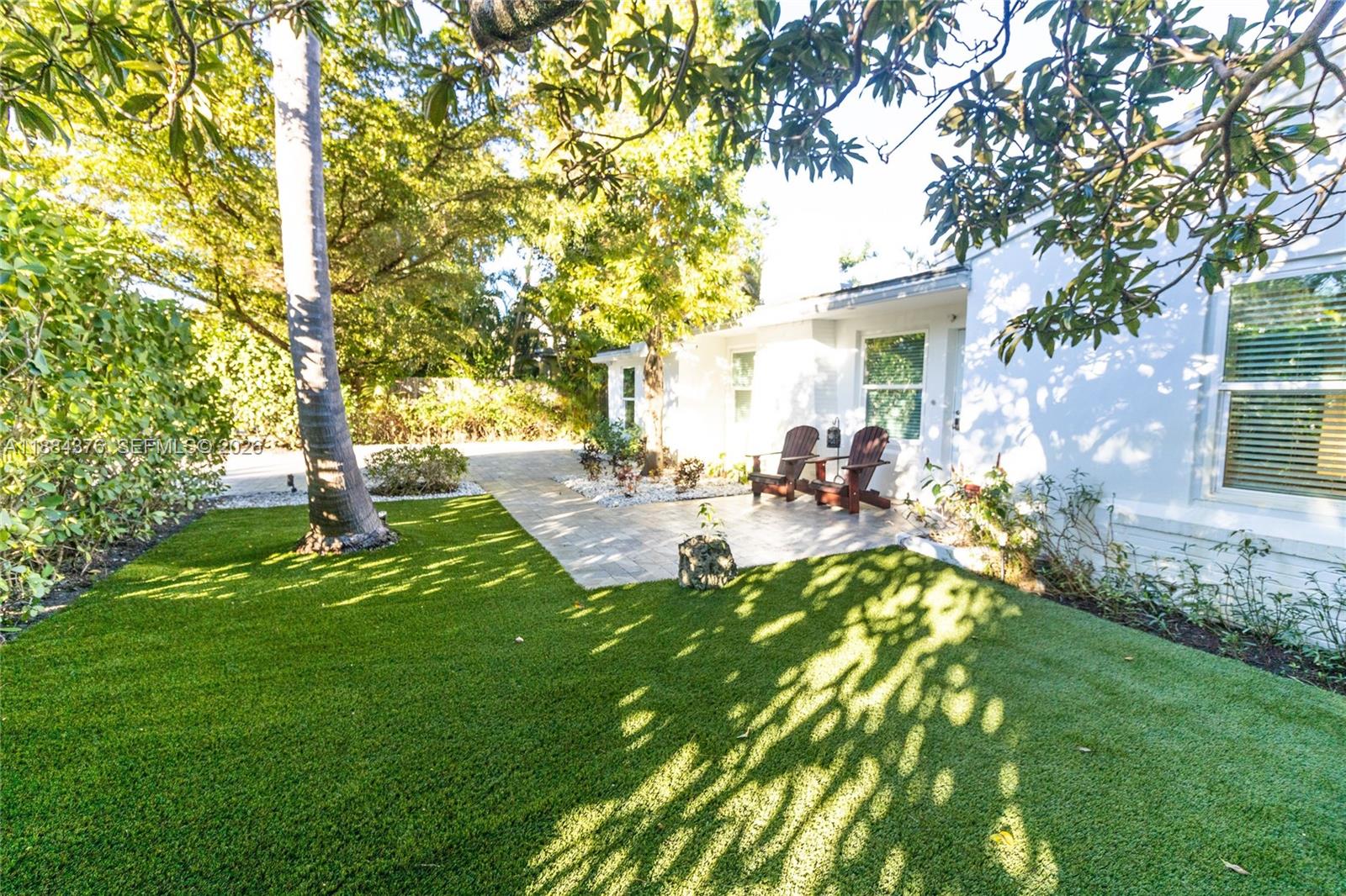 744 Northeast 16th Avenue Fort Lauderdale, FL 33304 - Photo 3 of 26 a view of a yard with plants and trees