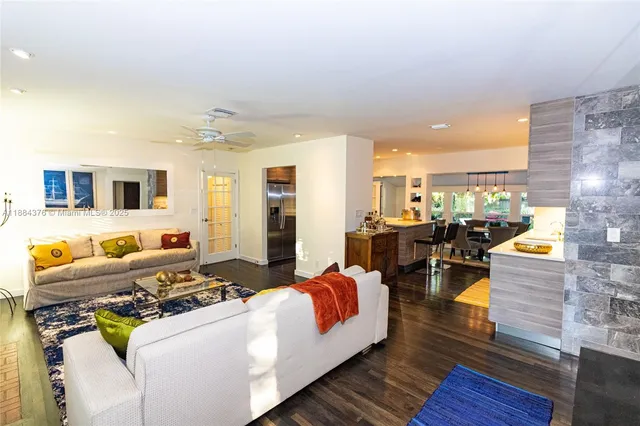 a living room with fireplace furniture and a flat screen tv