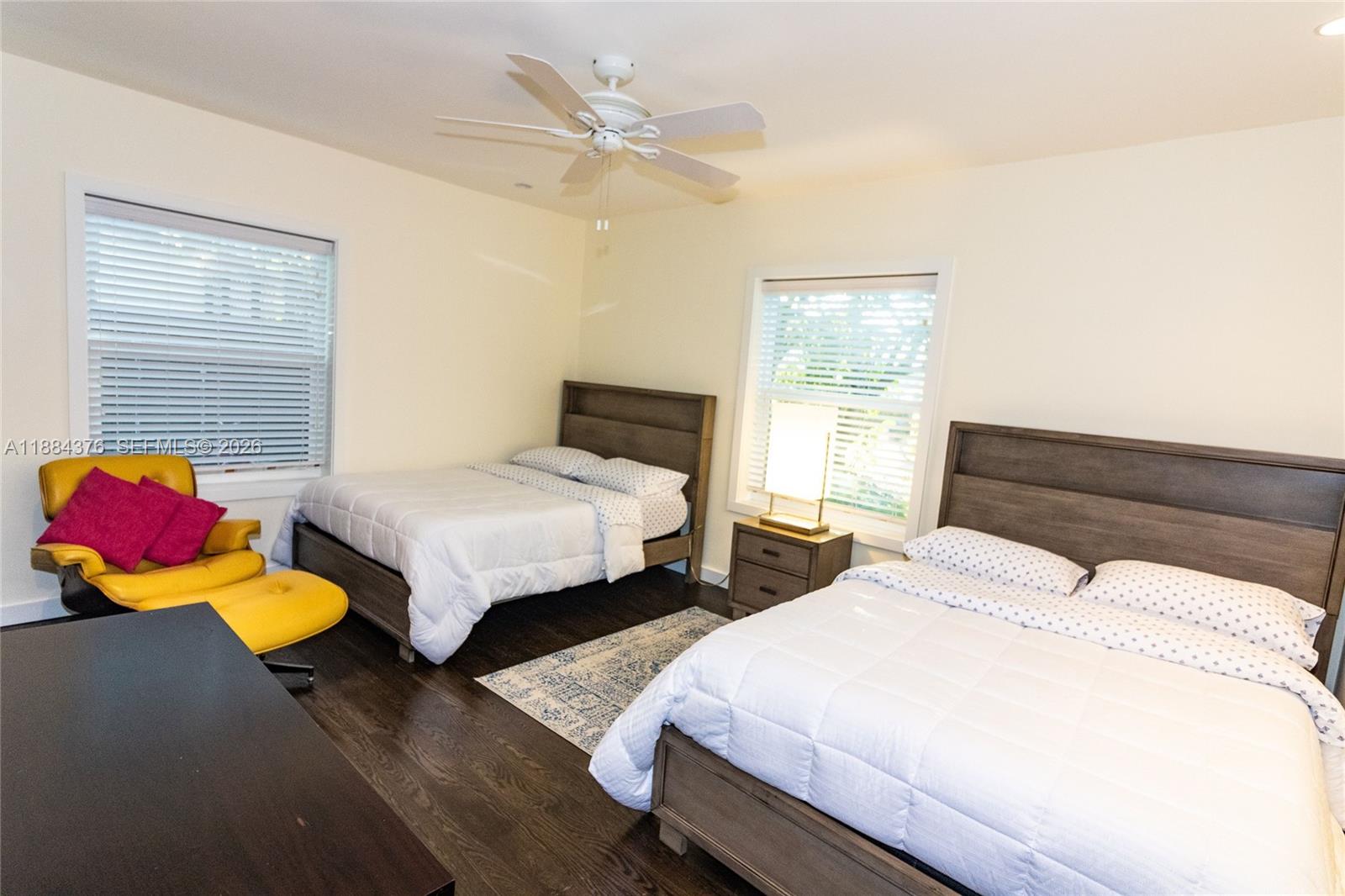 744 Northeast 16th Avenue Fort Lauderdale, FL 33304 - Photo 10 of 26 a bedroom with two beds and a window