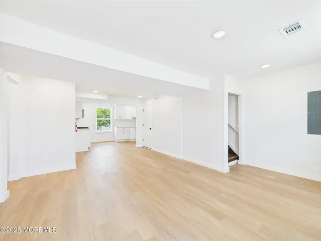 a hallway with sliding door and entryway