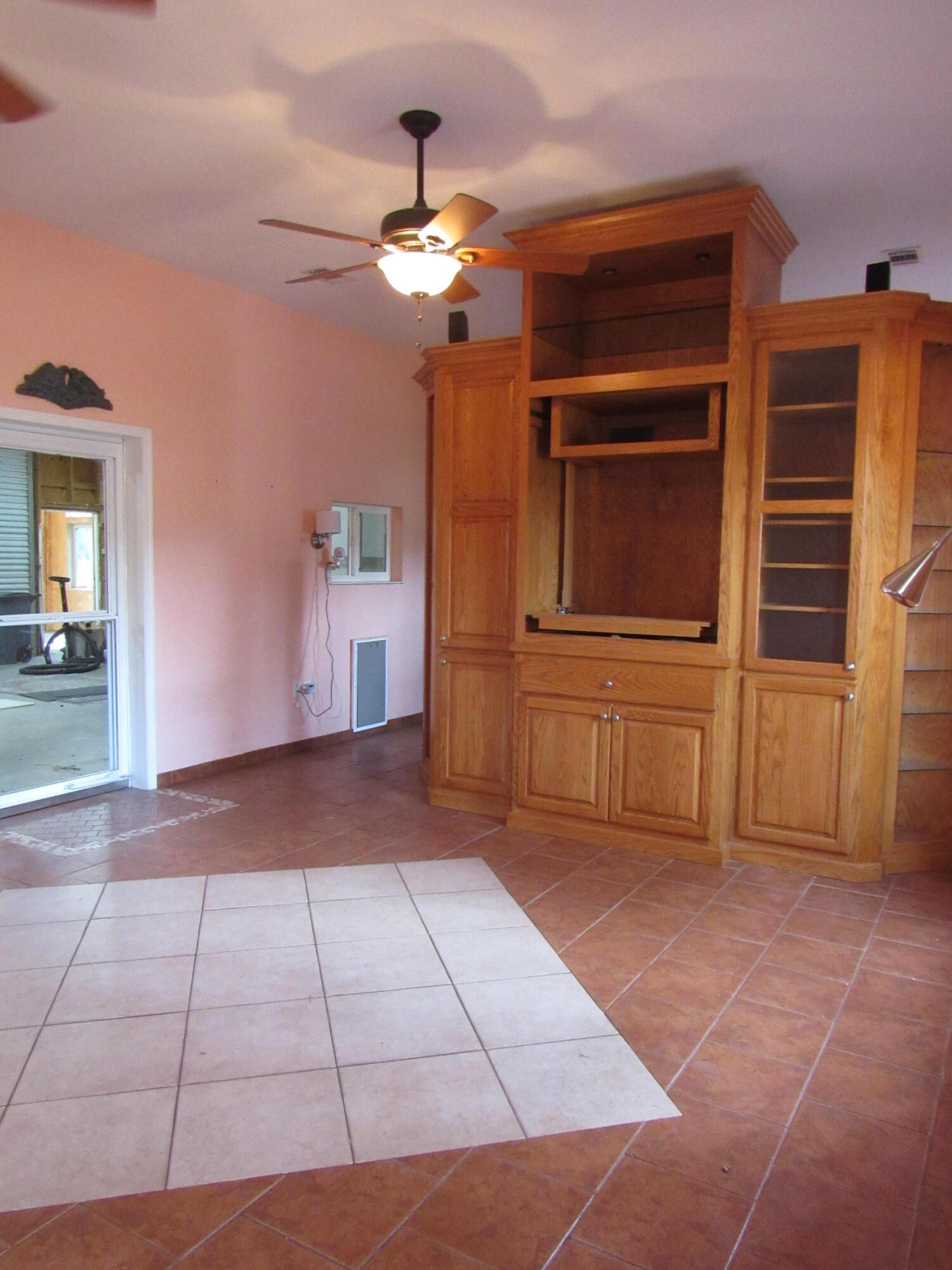 82 Palmetto Street Freeport, FL 32439 - Photo 16 of 55 a view of a livingroom with a cabinets
