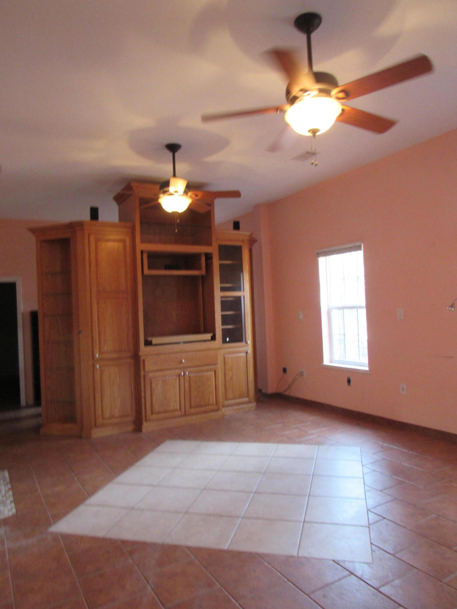 82 Palmetto Street Freeport, FL 32439 - Photo 17 of 55 a living room with a chandelier furniture and a ceiling fan
