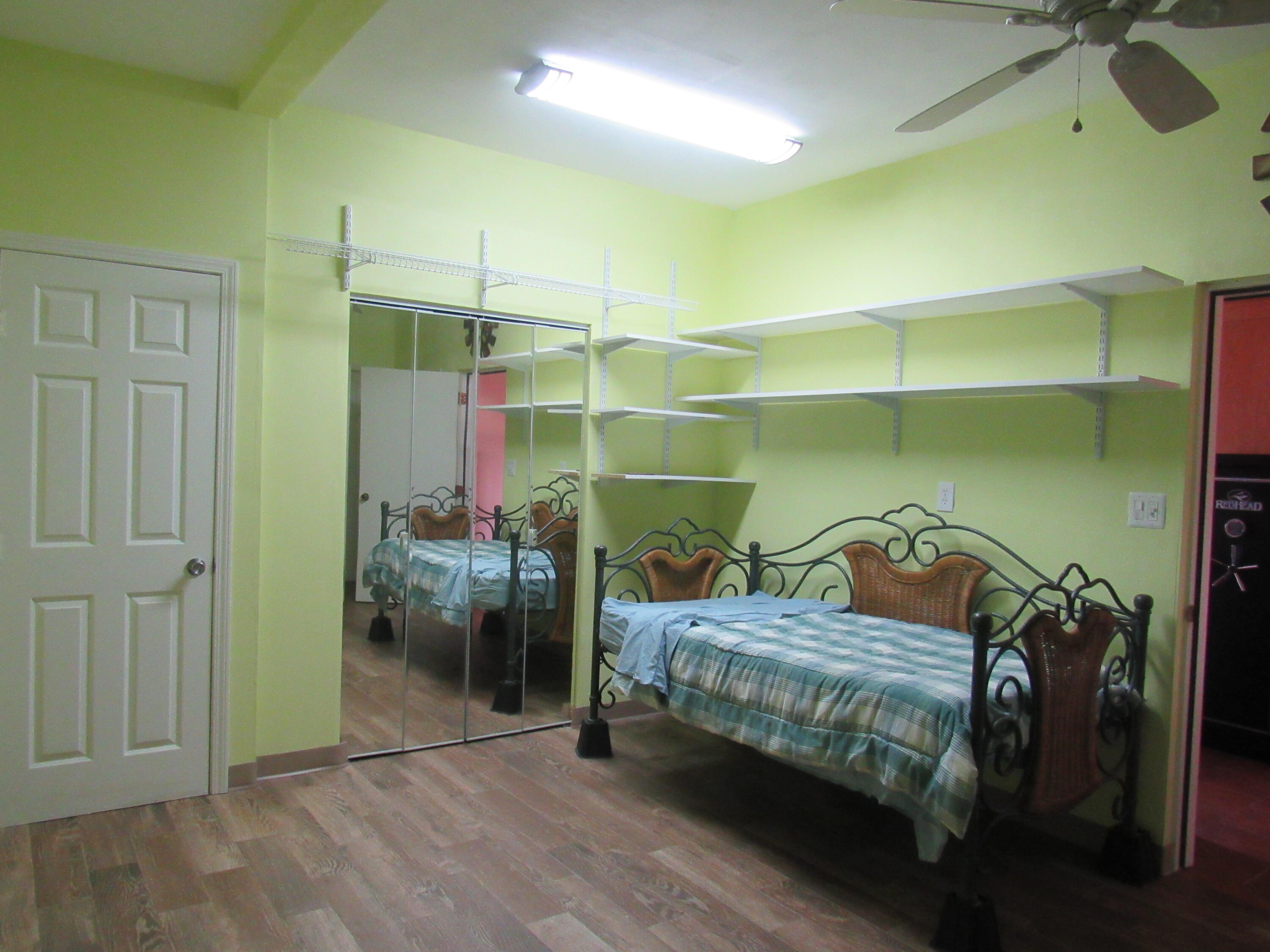 82 Palmetto Street Freeport, FL 32439 - Photo 20 of 55 a bedroom with a bed and a window