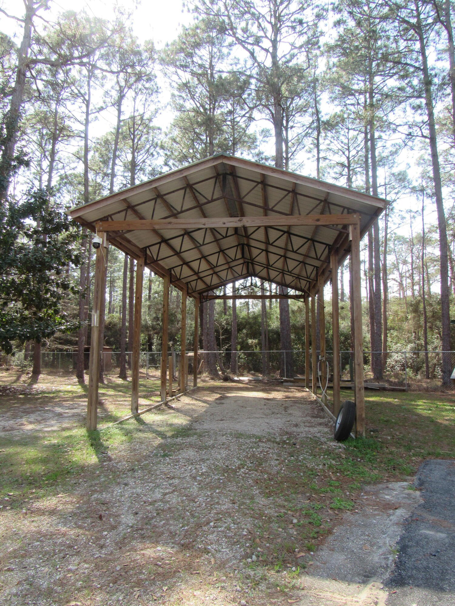 82 Palmetto Street Freeport, FL 32439 - Photo 2 of 55 a view of outdoor space with a table and chairs under an umbrella