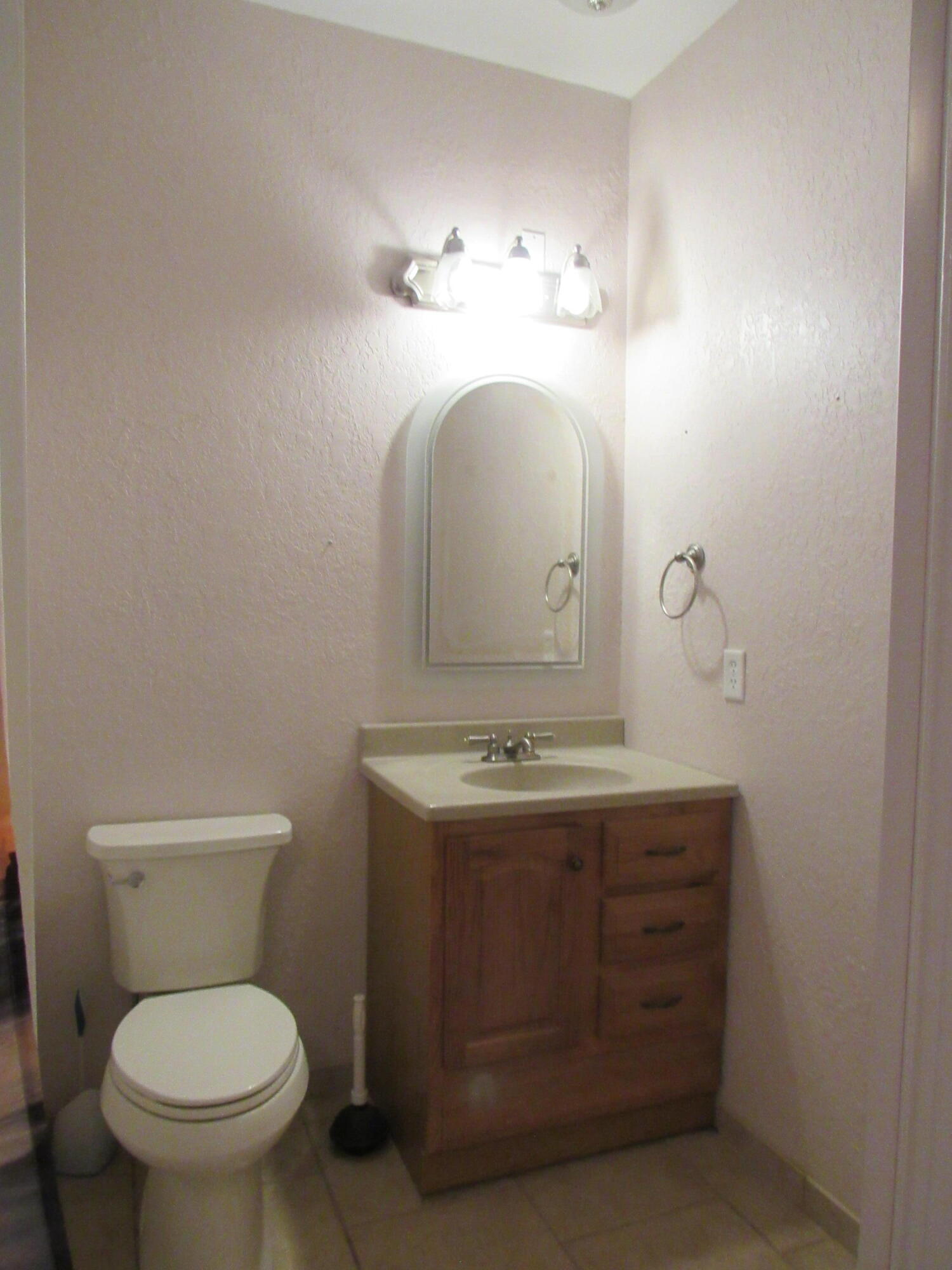 82 Palmetto Street Freeport, FL 32439 - Photo 27 of 55 a bathroom with a toilet sink and mirror