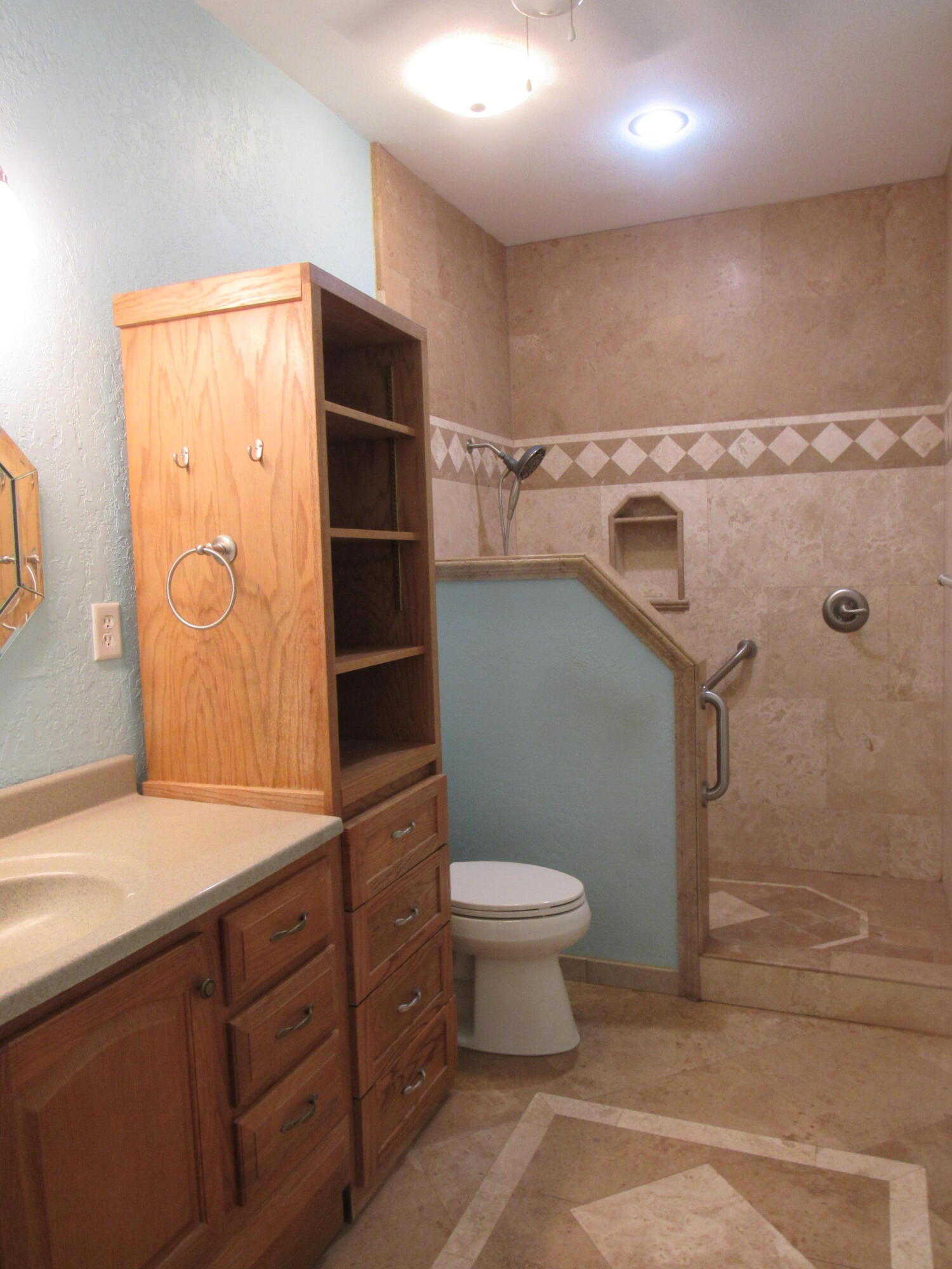 82 Palmetto Street Freeport, FL 32439 - Photo 31 of 55 a bathroom with a granite countertop sink a toilet and a mirror