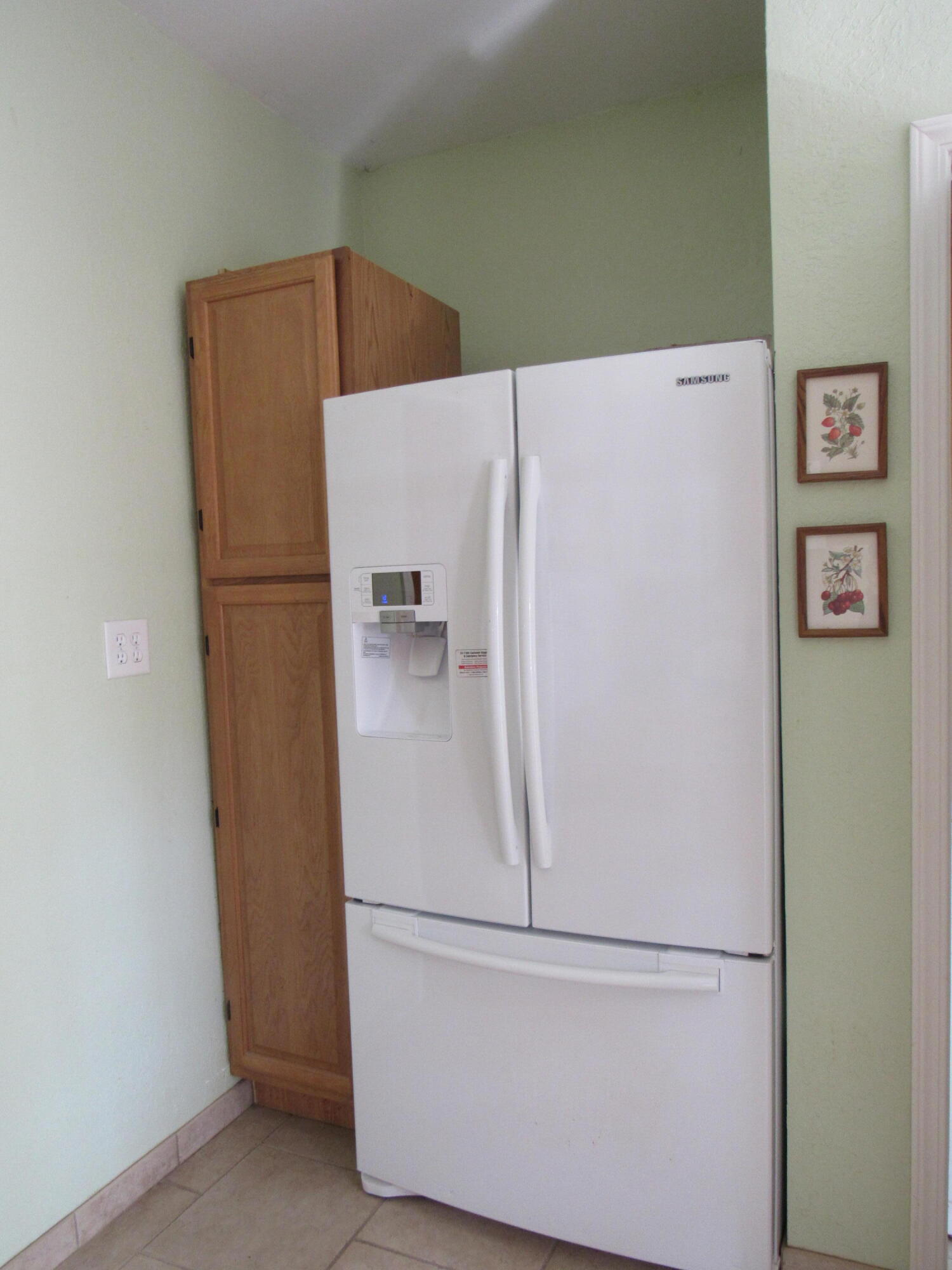 82 Palmetto Street Freeport, FL 32439 - Photo 35 of 55 a white refrigerator freezer sitting in a kitchen