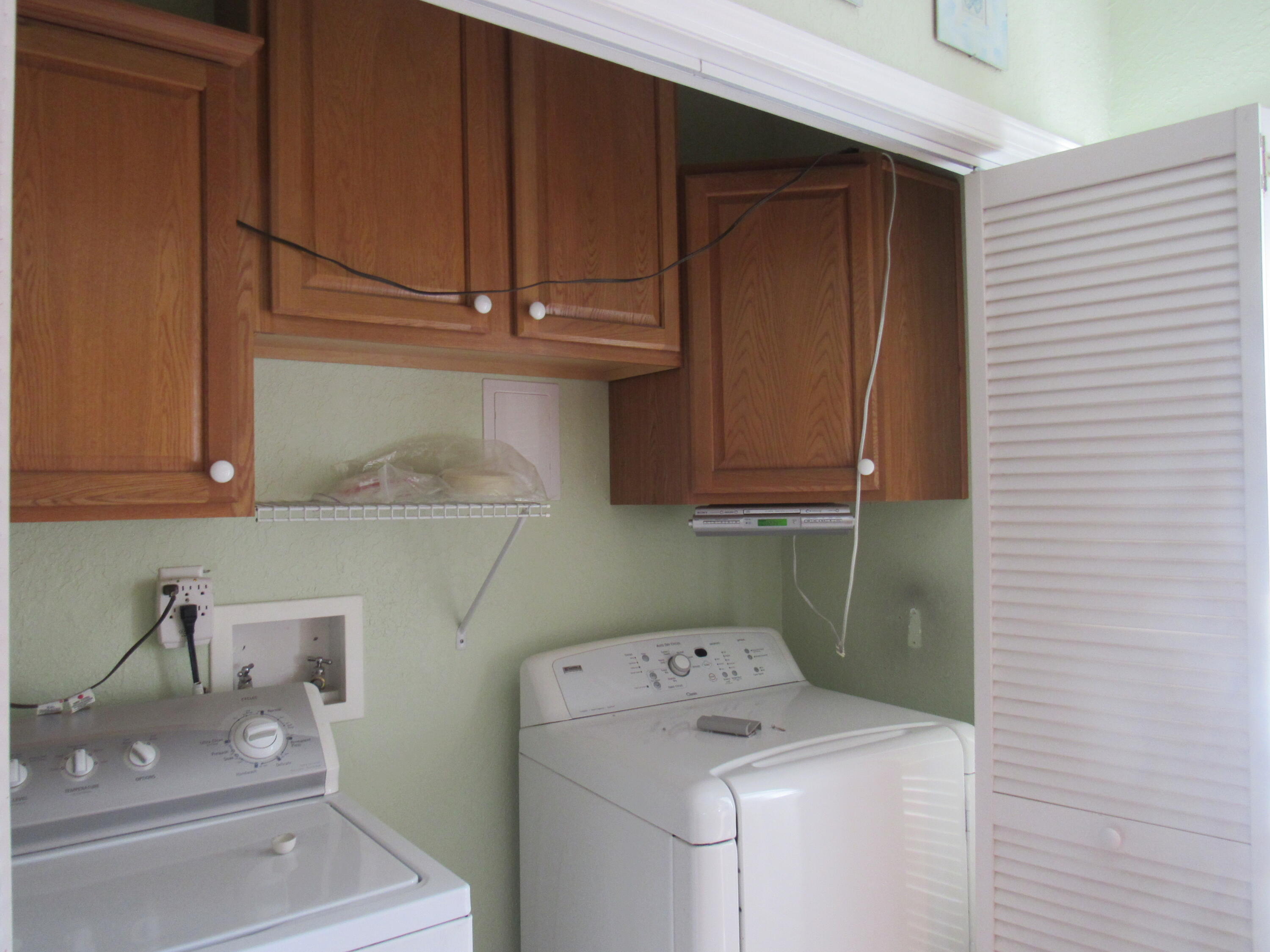 82 Palmetto Street Freeport, FL 32439 - Photo 36 of 55 a utility room with dryer and washer