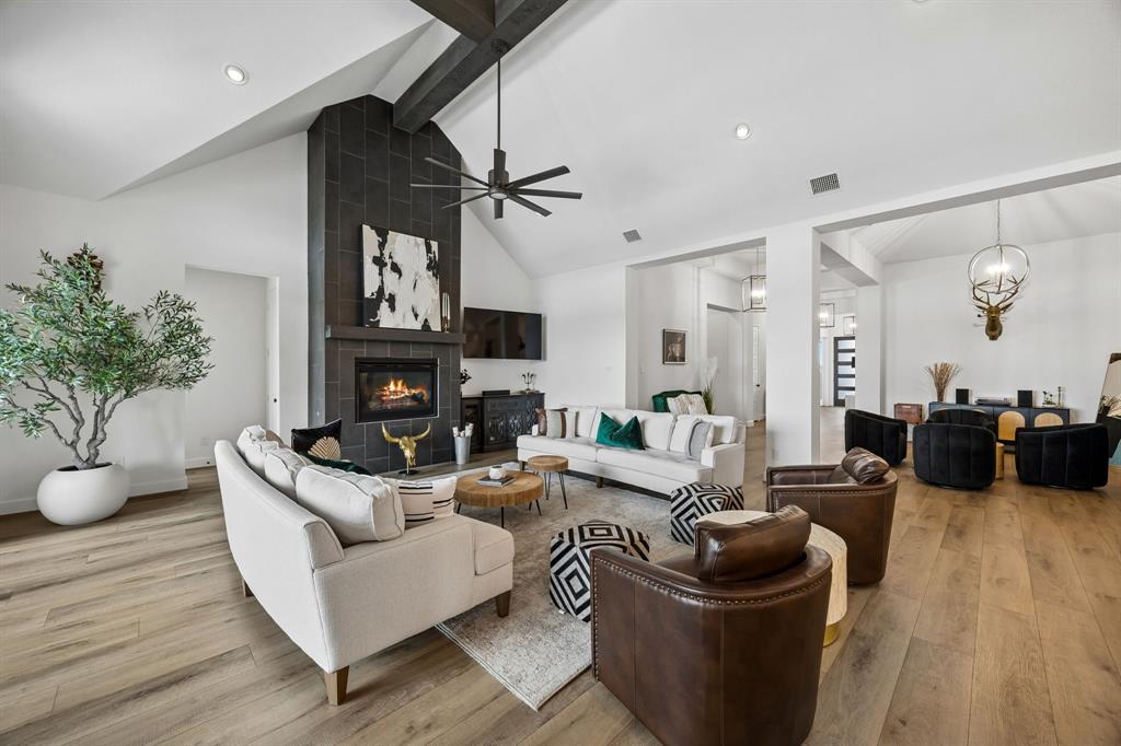 1908 Lotus Court Haslet, TX 76052 - Photo 12 of 40 Floor-To-Ceiling Fireplace And Cedar Beams Enhance Soaring Ceilings