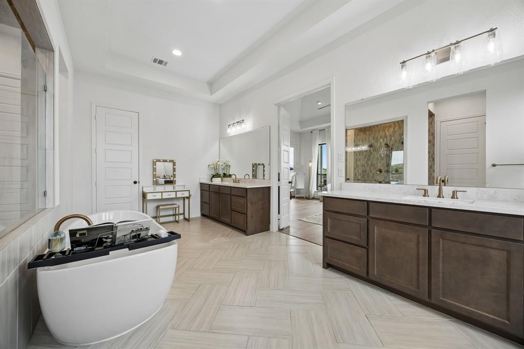 1908 Lotus Court Haslet, TX 76052 - Photo 21 of 40 Elegant Primary Bath With Soaking Tub, Walk-In Shower, And Dual Walk-In Closets
