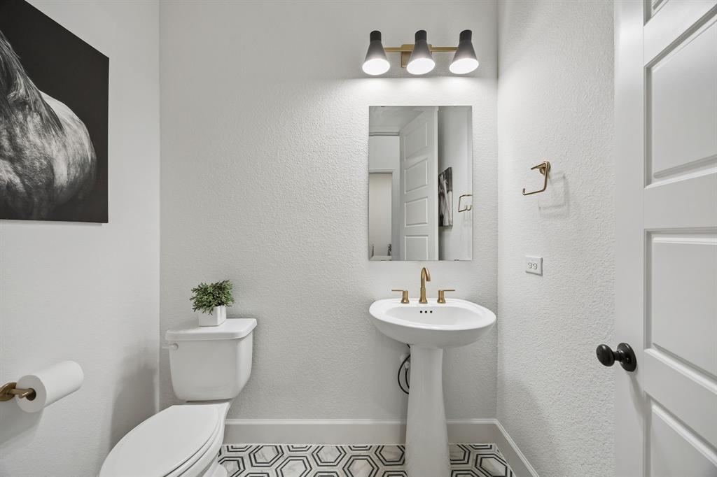 1908 Lotus Court Haslet, TX 76052 - Photo 27 of 40 Stylish Powder Bath Featuring Designer Finishes And Tile