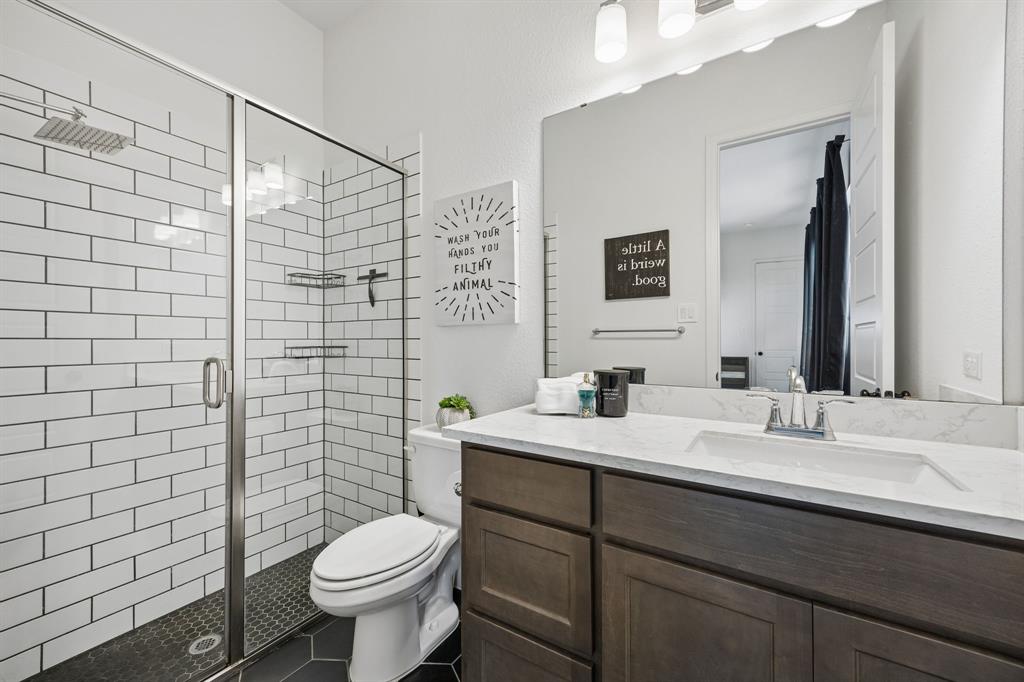 1908 Lotus Court Haslet, TX 76052 - Photo 29 of 40 Stylish Ensuite With Glass Shower And Subway Tile Surround