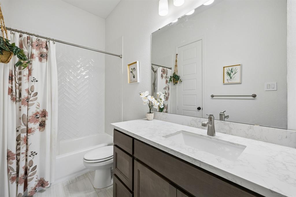 1908 Lotus Court Haslet, TX 76052 - Photo 33 of 40 Stylish Bath With Herringbone Tile Accents