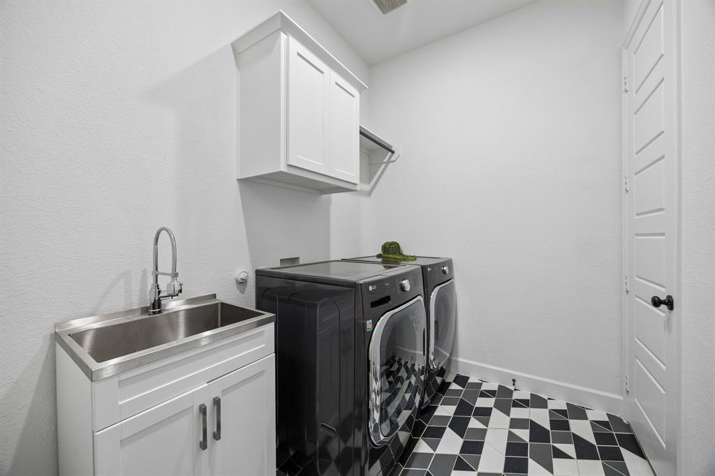 1908 Lotus Court Haslet, TX 76052 - Photo 34 of 40 Stylish Laundry Room With Statement Tile And Utility Sink