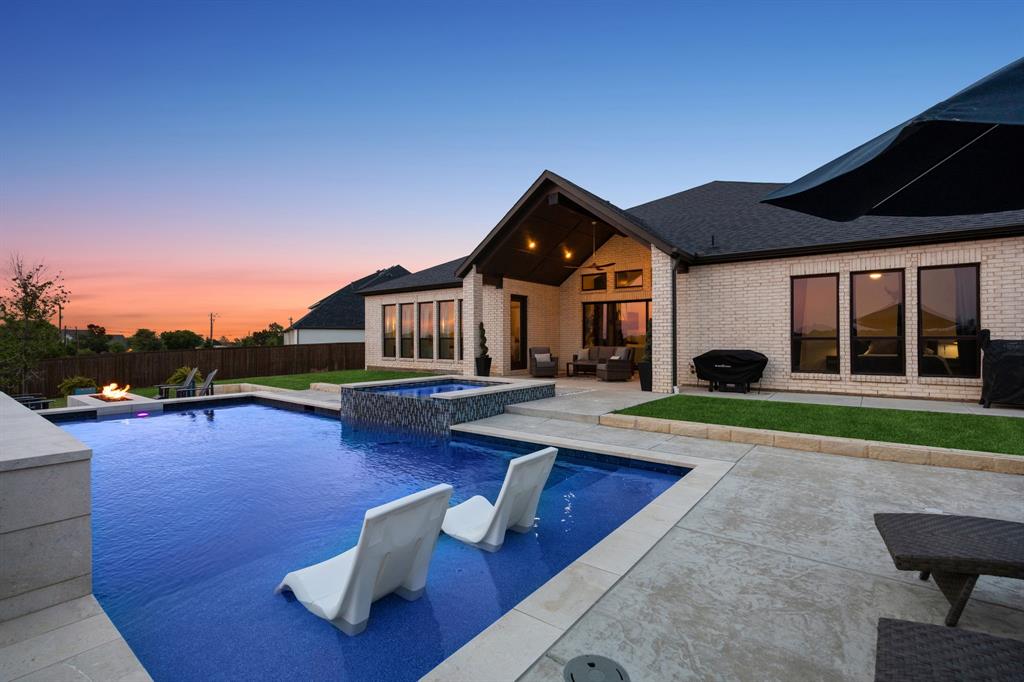 1908 Lotus Court Haslet, TX 76052 - Photo 4 of 40 Resort-Style Oasis With Sleek Design, Water Wall, And Tanning Ledge