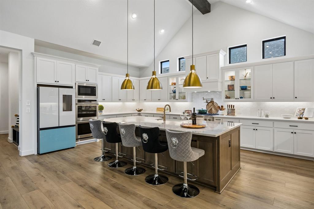 1908 Lotus Court Haslet, TX 76052 - Photo 7 of 40 Gourmet Kitchen With Oversized Island And Matte Black Hardware Accents