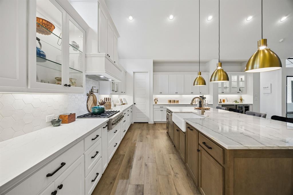 1908 Lotus Court Haslet, TX 76052 - Photo 8 of 40 Designer Kitchen With Bar Space, Pot Filler, And Premium Appliances