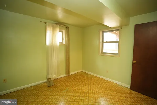a view of a big room with windows