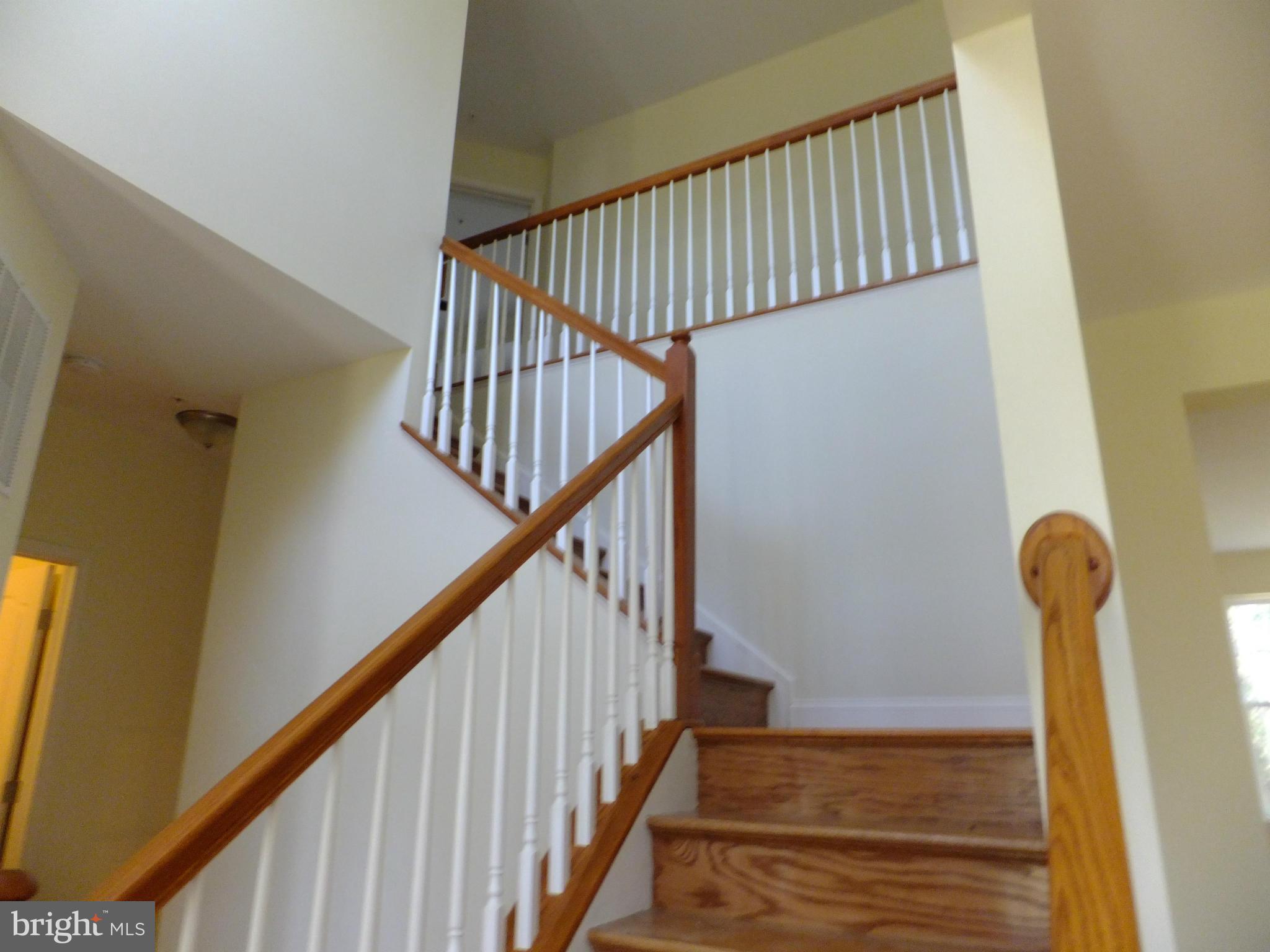 4698 Mountain Road Pasadena, MD 21122 - Photo 3 of 27 WINDING SOLID WOOD STAIRCASE