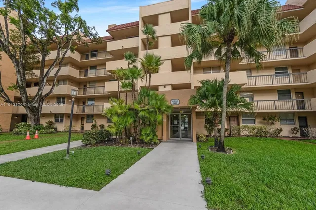 a kitchen with stainless steel appliances granite countertop a stove and a microwave