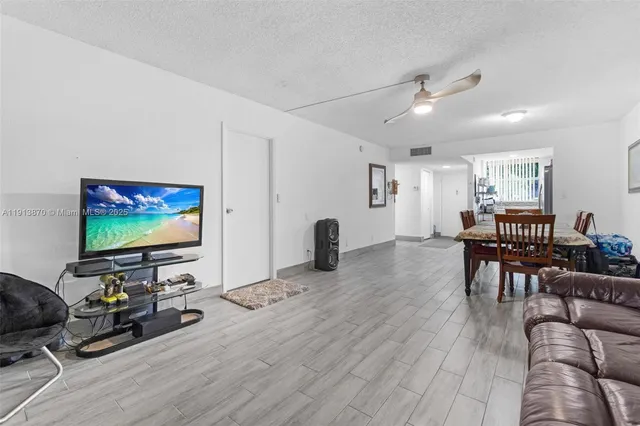 a potted plant sitting in front of a house