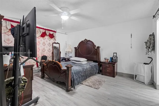 a kitchen with a refrigerator and a stove top oven