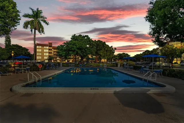 a view of swimming pool with outdoor seating