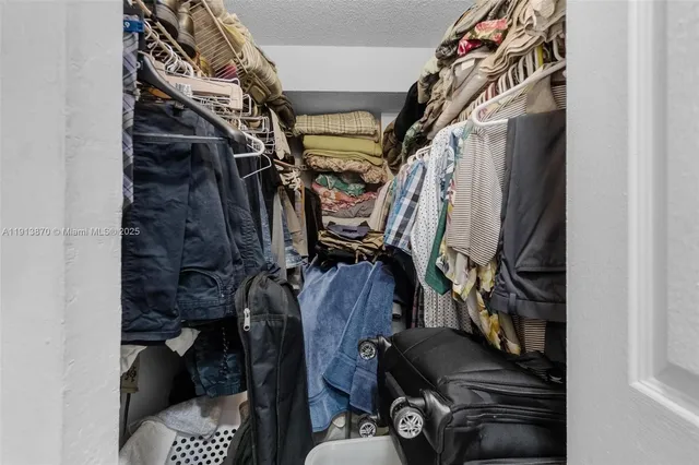 an aerial view of a house with a garden and lake view
