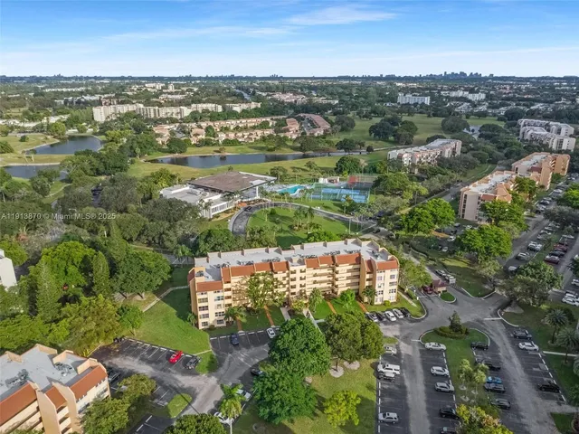 a large bed sitting in a bedroom next to a window