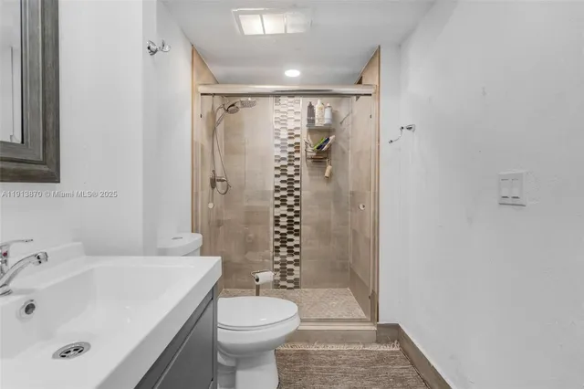 an aerial view of a house with outdoor space