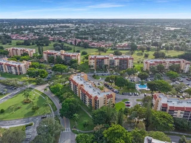 a room with pool table and windows