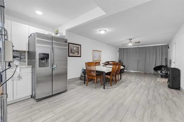 a view of a tall building next to a yard