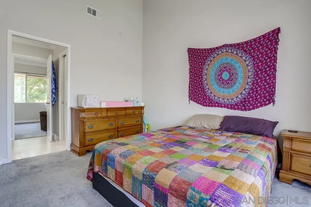 1673 Stone Edge Circle El Cajon, CA 92021 - Photo 11 of 20 a bedroom with a bed and a closet