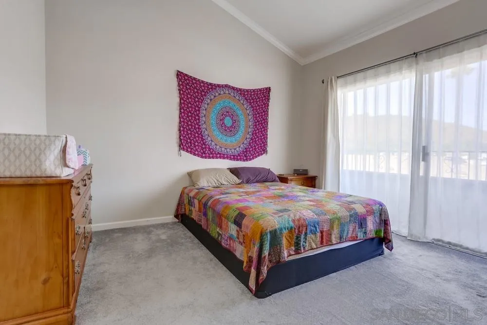 1673 Stone Edge Circle El Cajon, CA 92021 - Photo 12 of 20 a bedroom with a bed and window