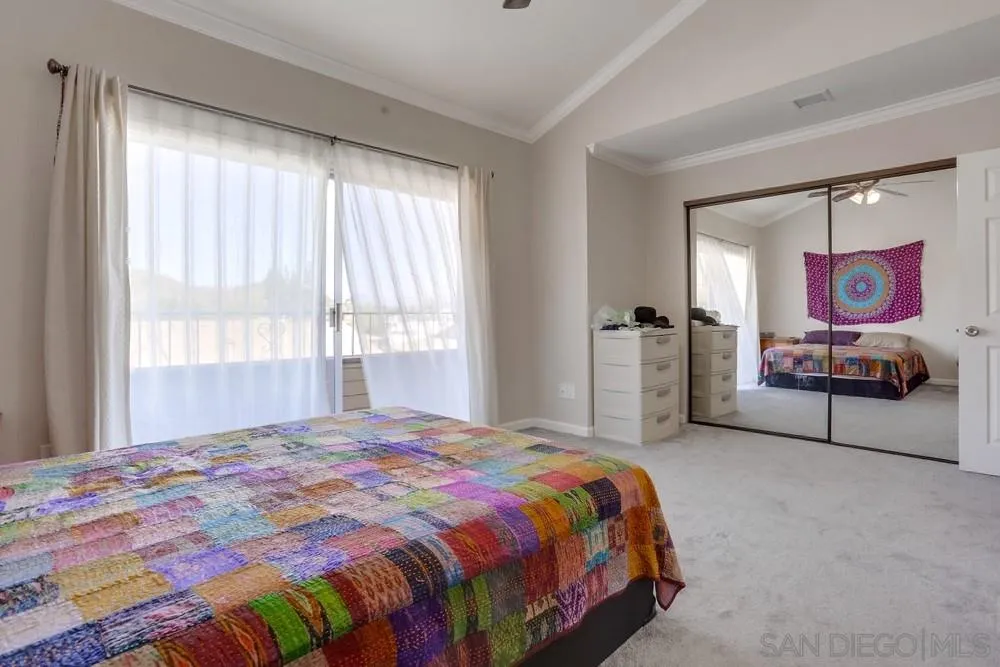 1673 Stone Edge Circle El Cajon, CA 92021 - Photo 13 of 20 a bedroom with a bed and window