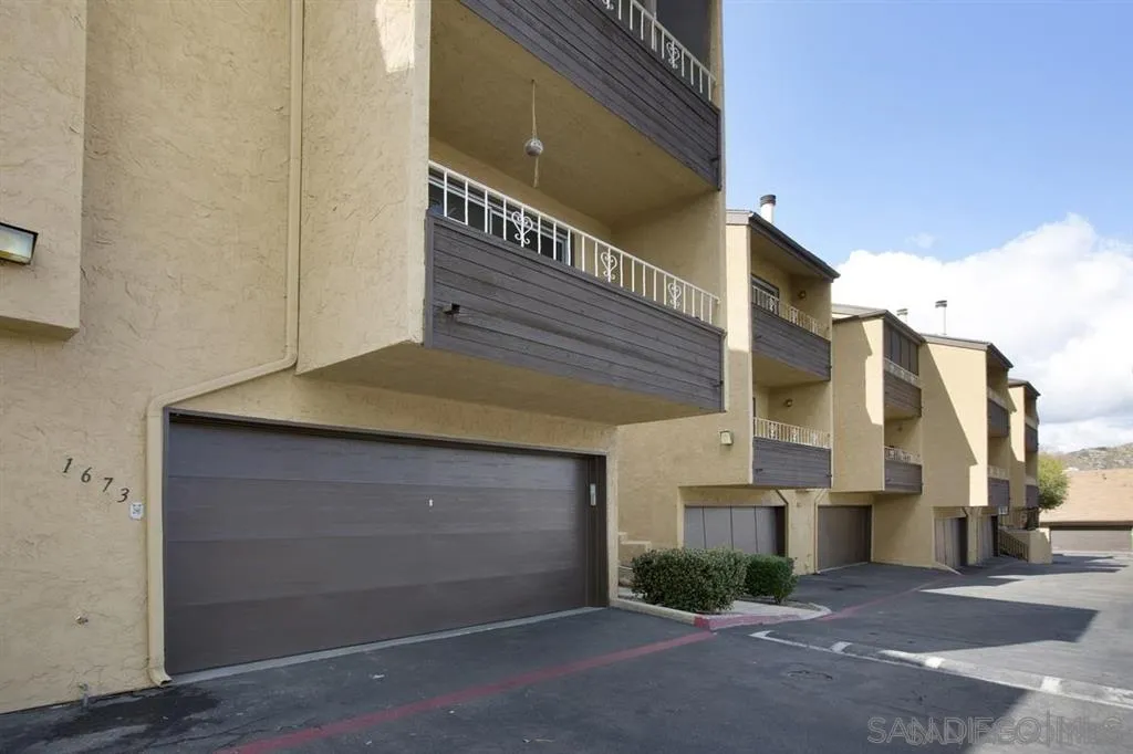 1673 Stone Edge Circle El Cajon, CA 92021 - Photo 17 of 20 a front view of a house with garage