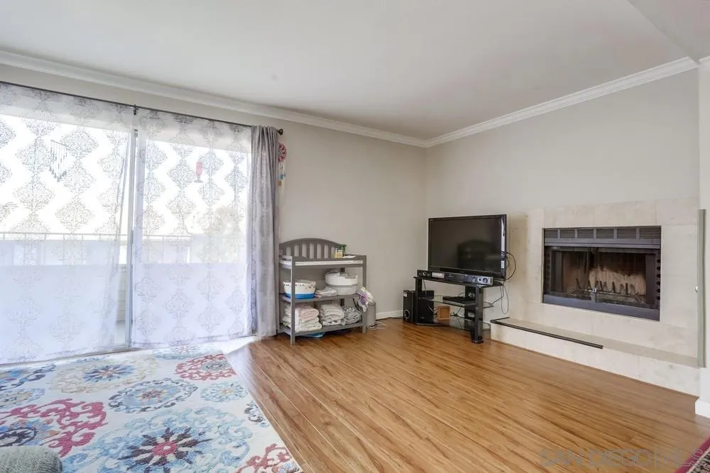1673 Stone Edge Circle El Cajon, CA 92021 - Photo 4 of 20 a bedroom with furniture and a fireplace