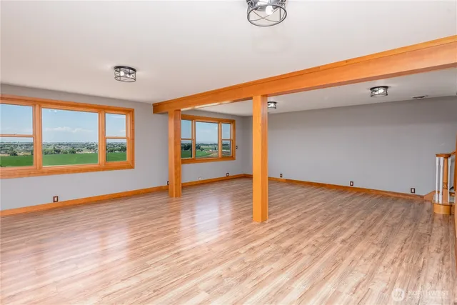 a view of an entryway with wooden floor