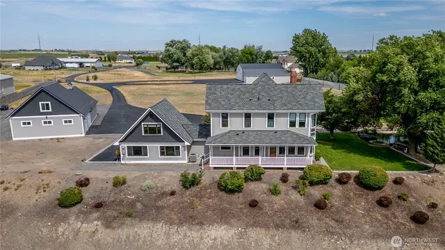 a aerial view of a house with a yard