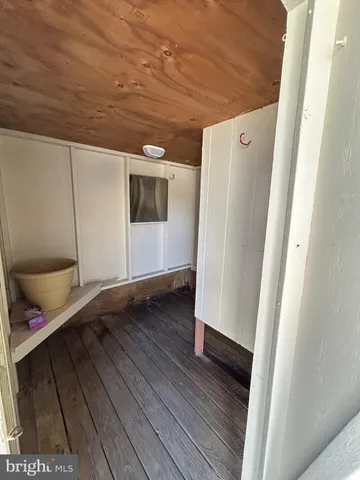 a view of an entryway with wooden floor