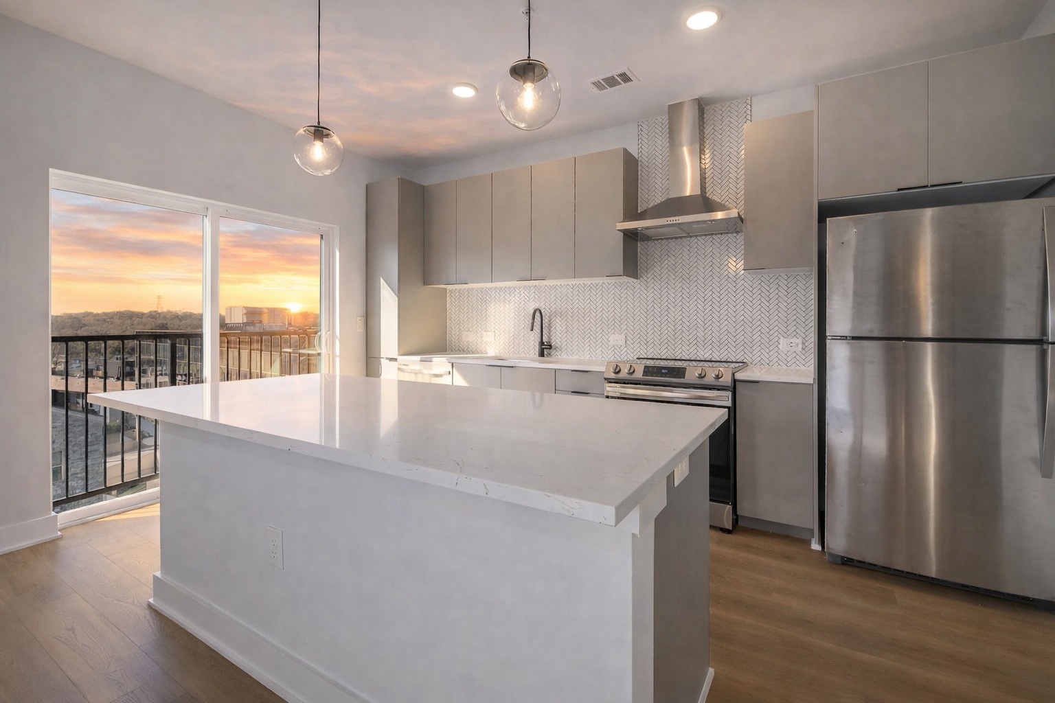 a kitchen with kitchen island a counter top a stove a refrigerator and a view of living room