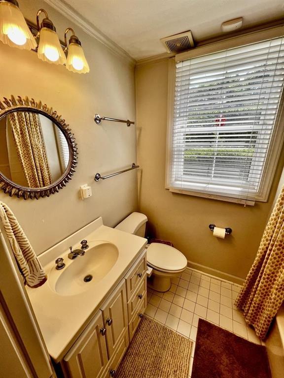 544 East Ponce De Leon Avenue, Unit TERRACE Decatur, GA 30030 - Photo 7 of 18 a bathroom with a sink a toilet and a mirror