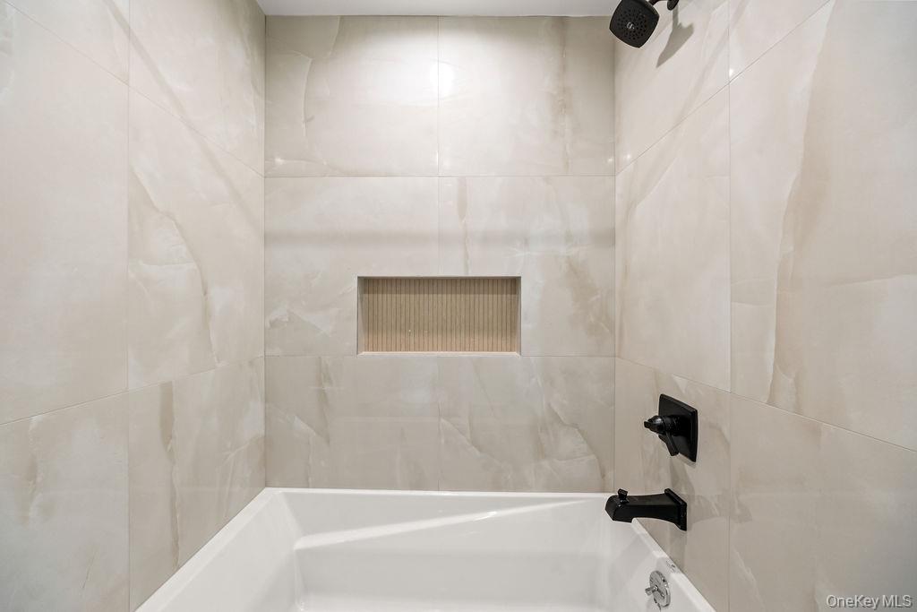 62 Blauvelt Road, Unit 202 Monsey, NY 10952 - Photo 25 of 34 a bathroom with a bathtub