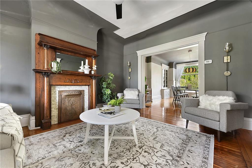 7723 Edgerton Avenue Pittsburgh, PA 15221 - Photo 4 of 25 a living room with furniture a fireplace and a table