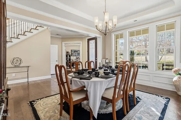 a view of a dining room with furniture window and outside view